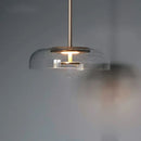 pendente italiano moderno, lustre pendente vidro fumê, pendente âmbar luxo, pendente transparente moderno, lustre design italiano, pendente meia lua vidro, pendente moderno sofisticado, iluminação gourmet moderna, pendente luxo contemporâneo, lustre pendente cozinha moderna, pendente minimalista vidro, pendente LEDZ mezza luna